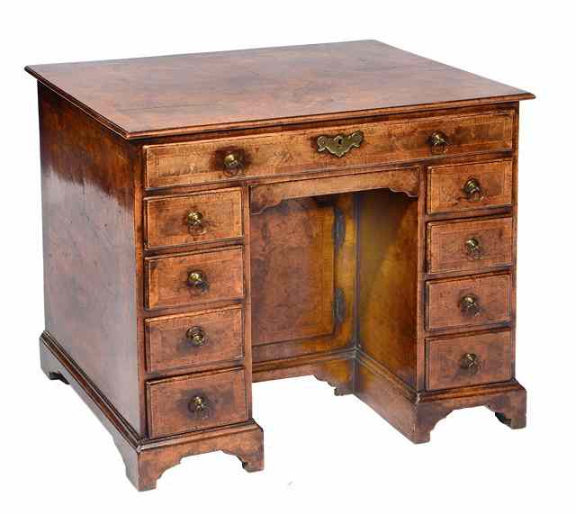 Appraisal: A QUEEN ANNE STYLE WALNUT PEDESTAL DESK the feather banded