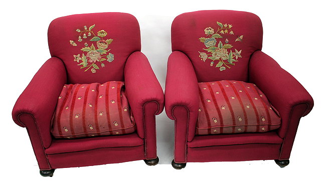 Appraisal: A PAIR OF LATE VICTORIAN OR EDWARDIAN ARMCHAIRS with scrolling