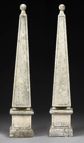 Appraisal: A pair of Neoclassical style cast stone garden obelisks first