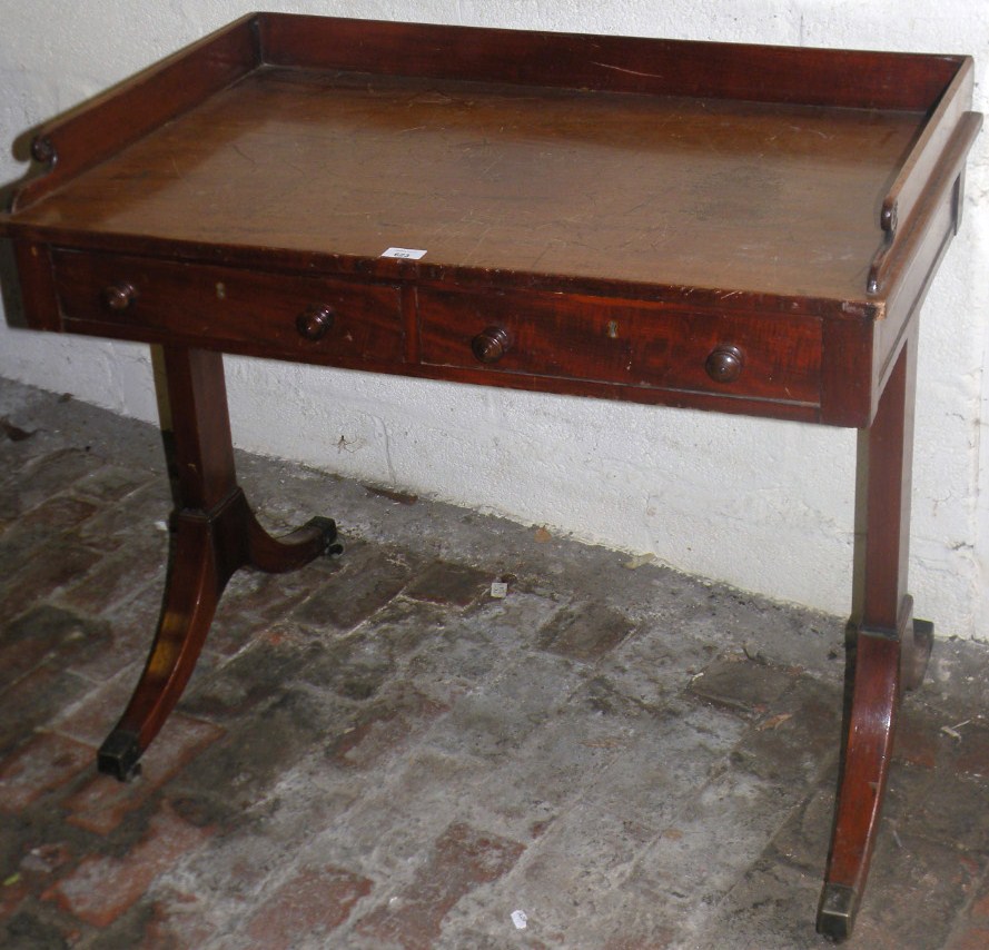 Appraisal: A thC mahogany tray top washstand with a galleried back