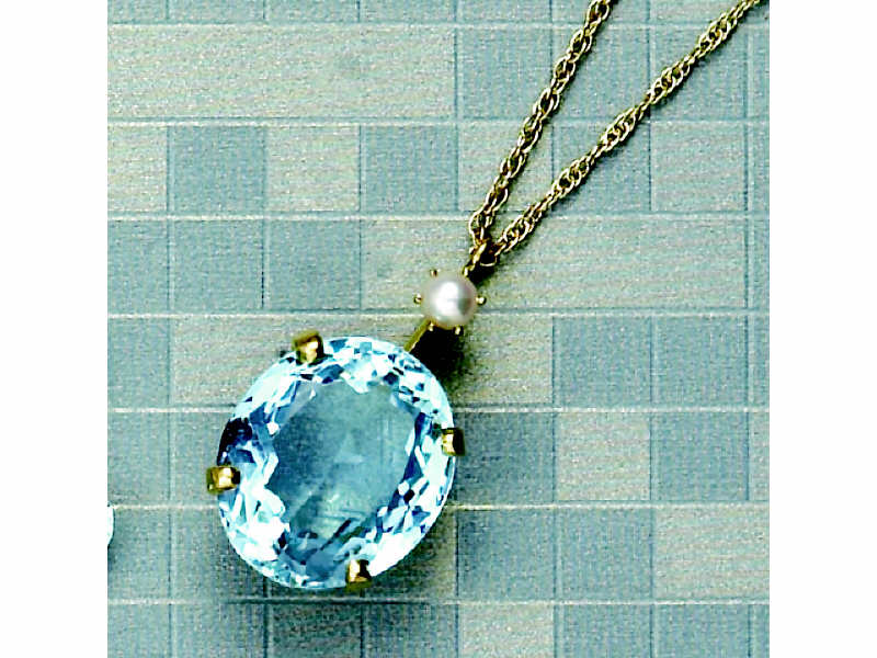 Appraisal: AQUAMARINE PENDANT Yellow gold pendant set with one oval faceted