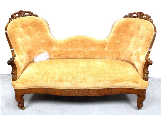 Appraisal: Victorian sofa shaped and upholstered backrest pierced scroll carvings to