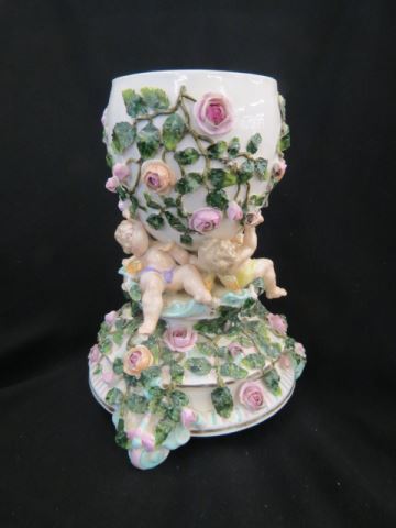 Appraisal: German Victorian Porcelain Figural Vase cherubs holding up central vase