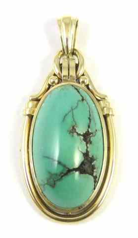 Appraisal: TURQUOISE AND FOURTEEN KARAT GOLD PENDANT set with a large