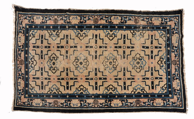 Appraisal: AN ANTIQUE NINGXIA BLUE AND WHITE RUG with stylistic panels