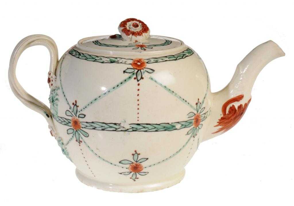 Appraisal: A CREAMWARE TEAPOT AND COVER possibly Dutch-decorated with entwined handle