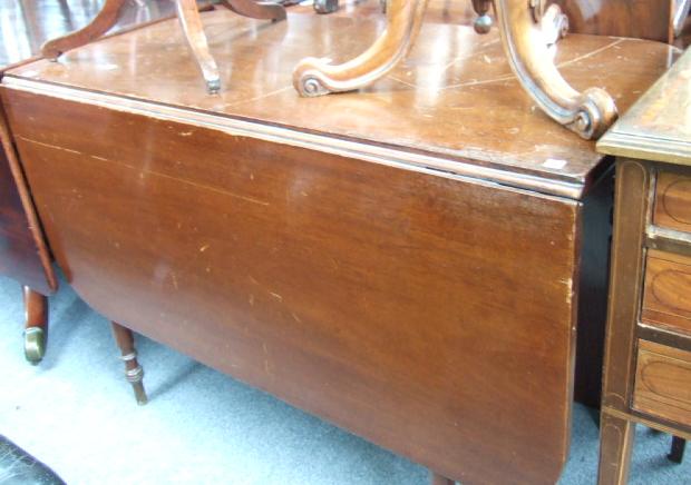 Appraisal: A Regency mahogany inlaid corner washstand raised on splayed supports