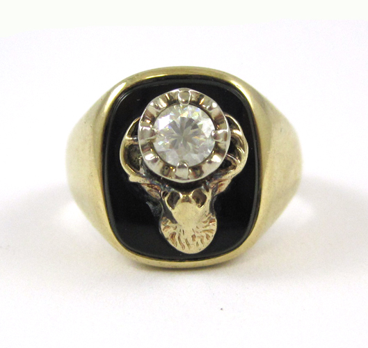 Appraisal: BLACK ONYX AND FOURTEEN KARAT GOLD RING with a cushion