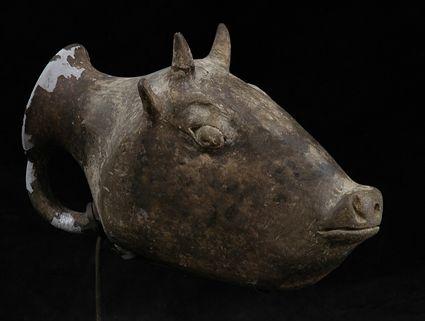 Appraisal: PERSIAN TERRACOTTA RHYTHON IN THE FORM OF A BULL'S HEAD