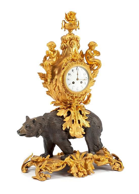 Appraisal: A Louis XV Style Gilt and Patinated Bronze Figural Clock