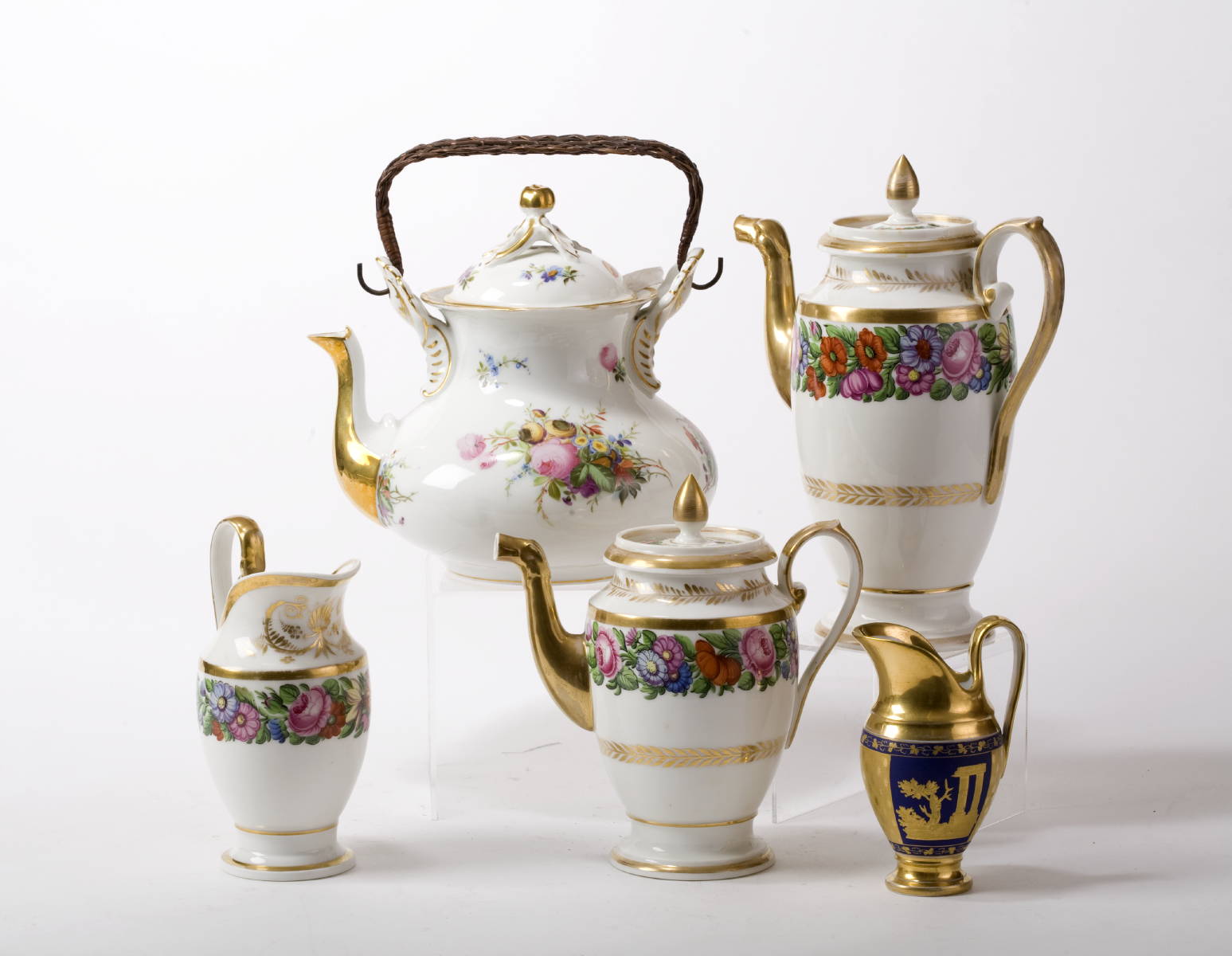 Appraisal: CONTINENTAL PORCELAIN THREE-PIECE TEA SET COMPRISING A CHOCOLATE POT A