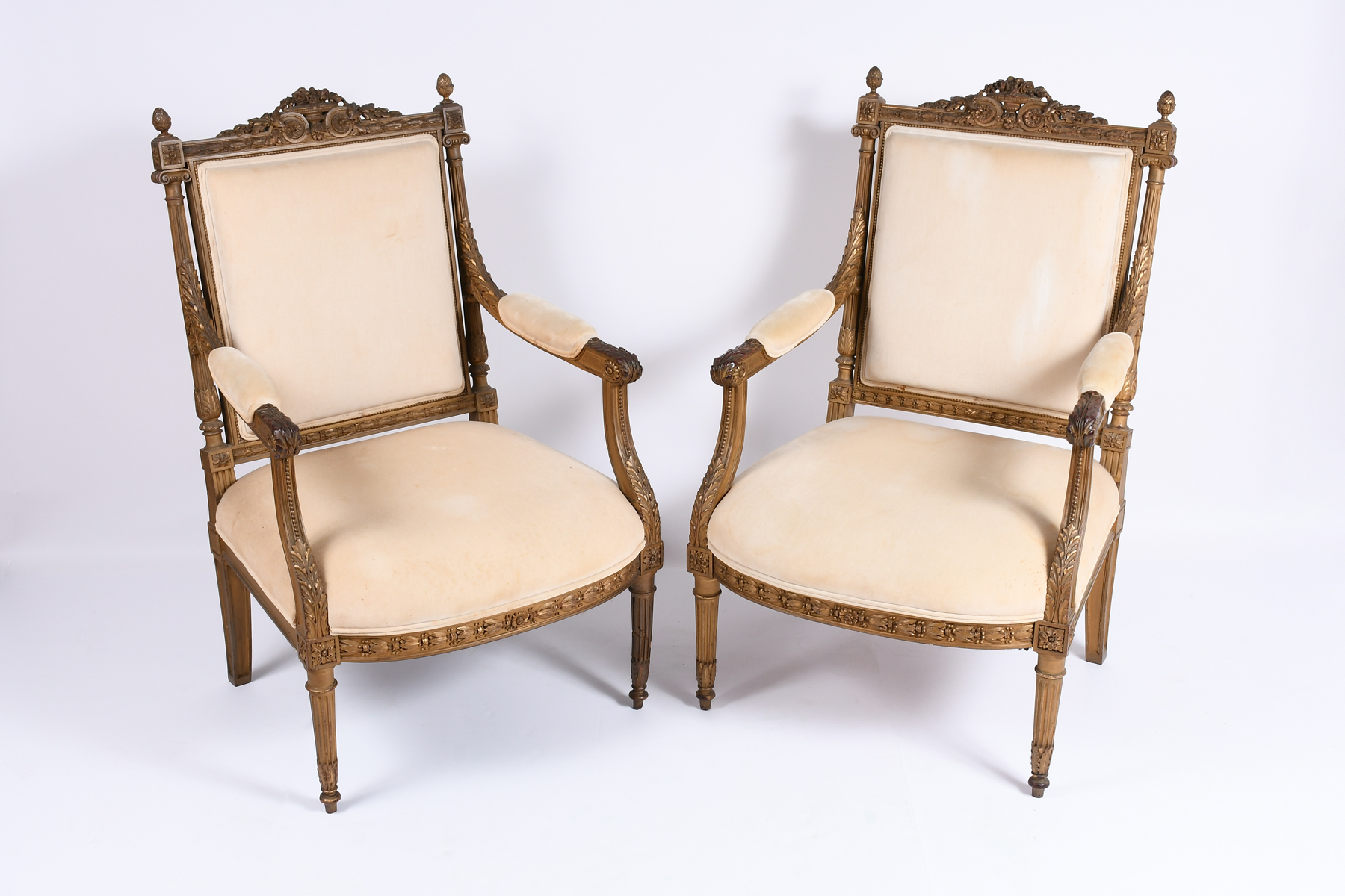 Appraisal: PAIR OF LATE TH-C CARVED OPEN ARM SIDE CHAIRS Extensively