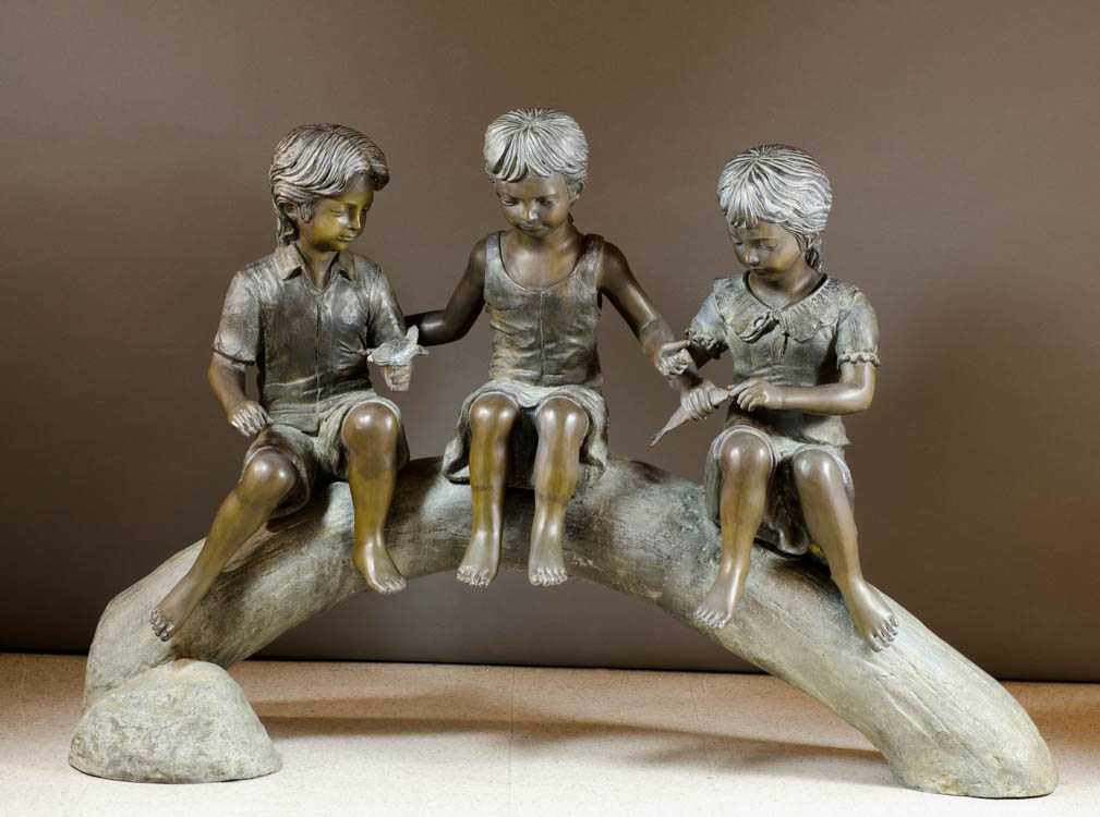 Appraisal: FIGURAL PATINATED BRONZE GARDEN SCULPTURE three children seated together on