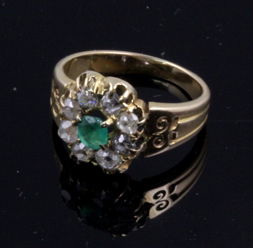 Appraisal: An emerald and diamond cluster ring the central emerald to