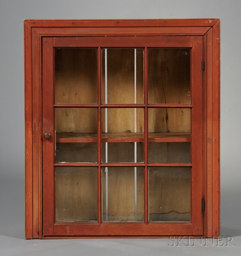 Appraisal: Red-painted Pine Glazed Hanging Cupboard New England early th century