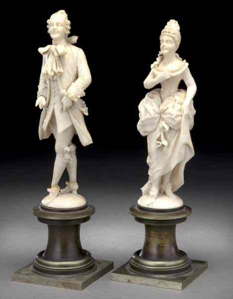 Appraisal: Pr French carved ivory figures modeled as a lady This