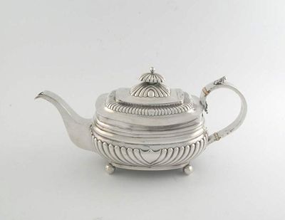 Appraisal: A George III boat shaped teapot fluted lower body knop