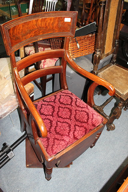 Appraisal: A GEORGIAN MAHOGANY BAR BACK COMMODE ARMCHAIR with inset seat