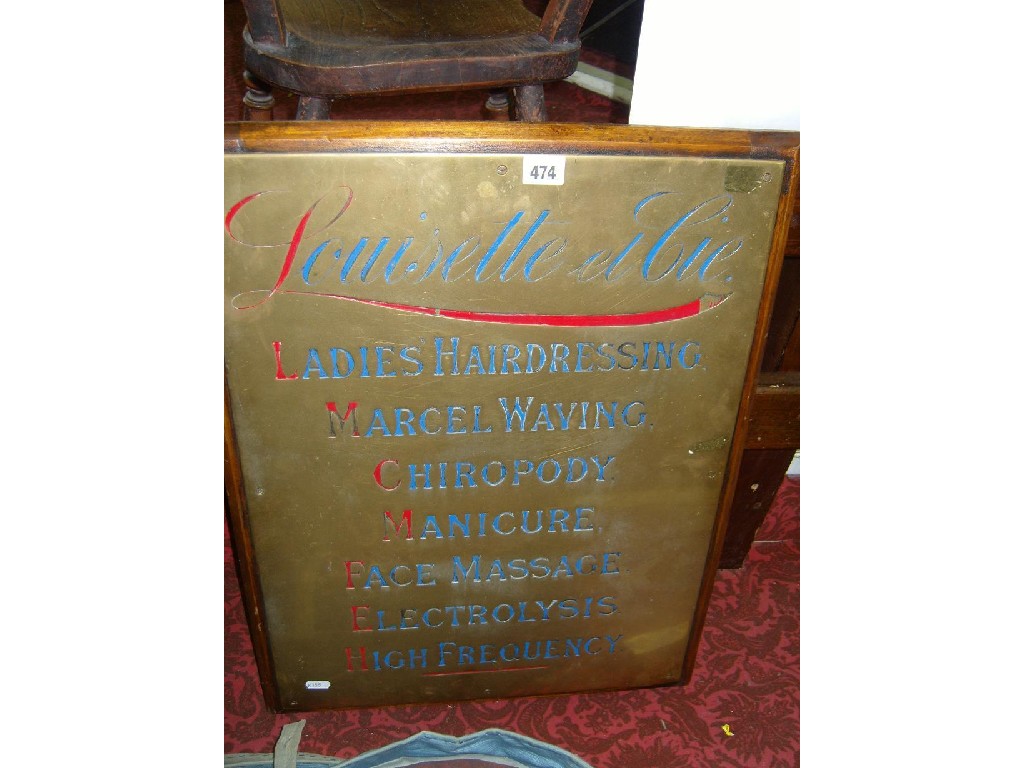 Appraisal: A beauticians brass advertising sign for Louisette et Cie advertising