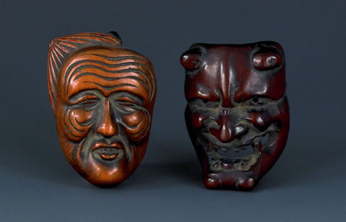 Appraisal: Japanese carved boxwood mask by Deme-Unkyo together with another similar