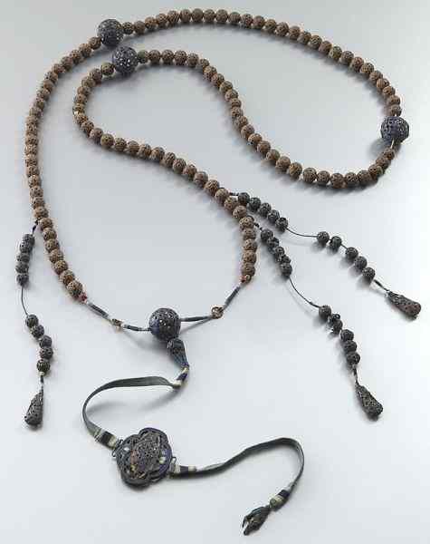 Appraisal: Chinese Qing carved wood and enamel over silvercourt beads ''L