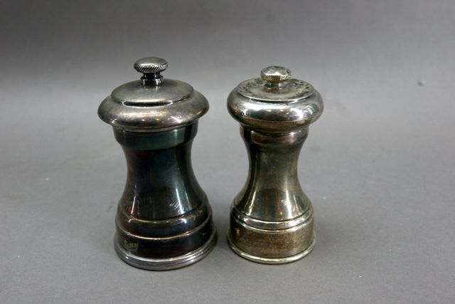 Appraisal: A Peugeot silver plated pepper grander together with a swaisted