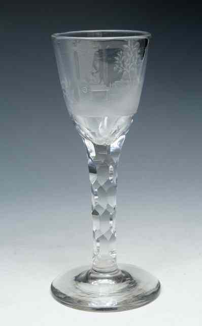 Appraisal: A HEXAGONAL FACET STEM WINE GLASS bowl engraved with country