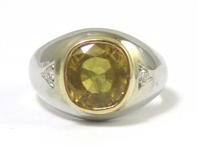 Appraisal: MAN'S GOLDEN SAPPHIRE AND DIAMOND RING k white gold set