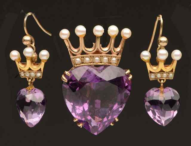 Appraisal: AN AMETHYST AND PEARL SET CORONET BROOCH claw set heart