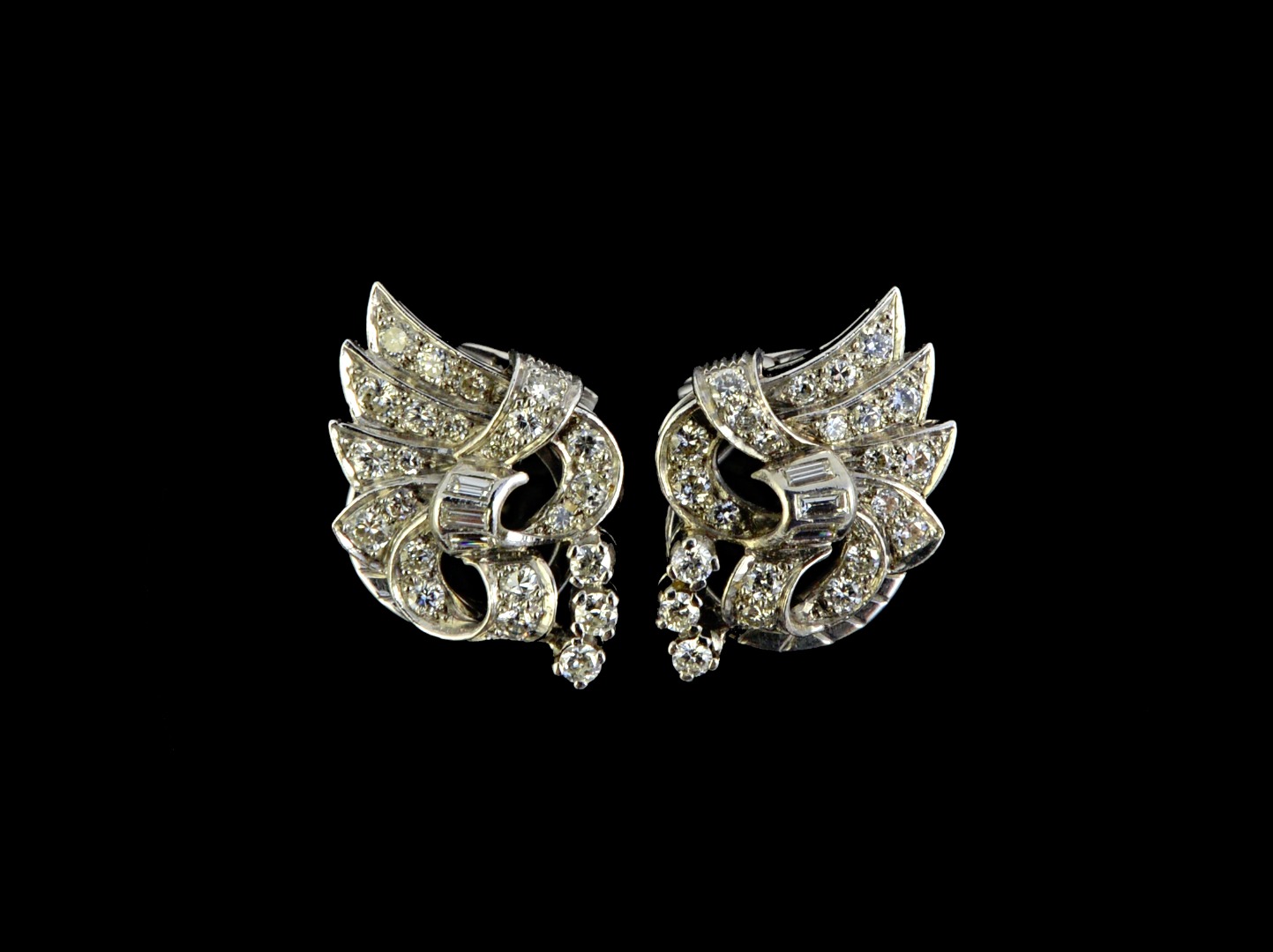 Appraisal: A pair of diamond set earclips each in a fanned