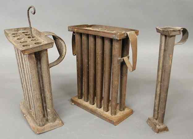 Appraisal: Three tin candle molds- two for candles each and one