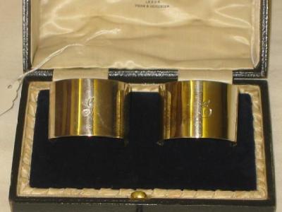 Appraisal: A PAIR OF NAPKIN RINGS of plain form one initialled