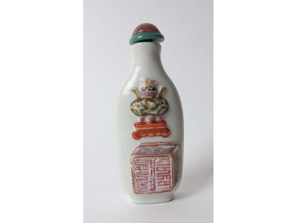 Appraisal: A Chinese porcelain moulded snuff bottle with a censer above