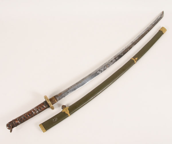 Appraisal: Decorated Japanese military sword with scabbard blade engraved with animals