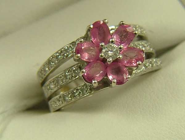 Appraisal: RUBY AND DIAMOND FLOWER-FORM RING K white gold pierced shank