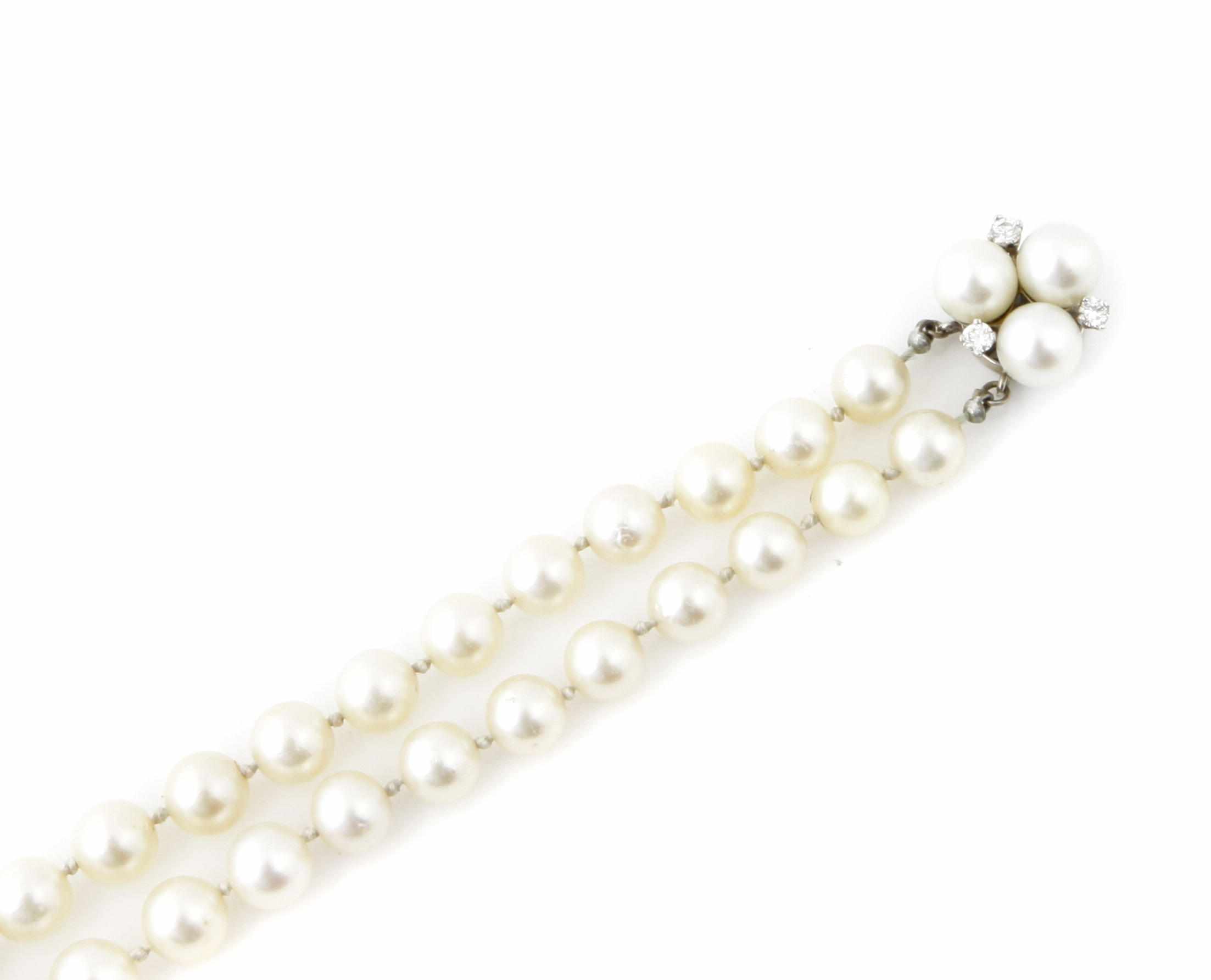 Appraisal: A cultured pearl diamond and k white gold double strand