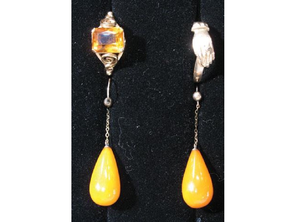 Appraisal: A PAIR OF AMBER DROP EARRINGS a Regency style yellow