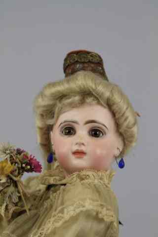 Appraisal: FRENCH MUSICAL AUTOMATON WITH JUMEAU HEAD Closed mouth flanged head