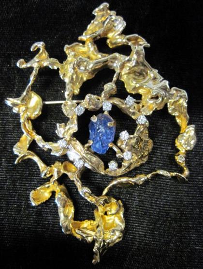 Appraisal: karat yellow gold abstract brooch Paul WaldmanAccented by nine prong