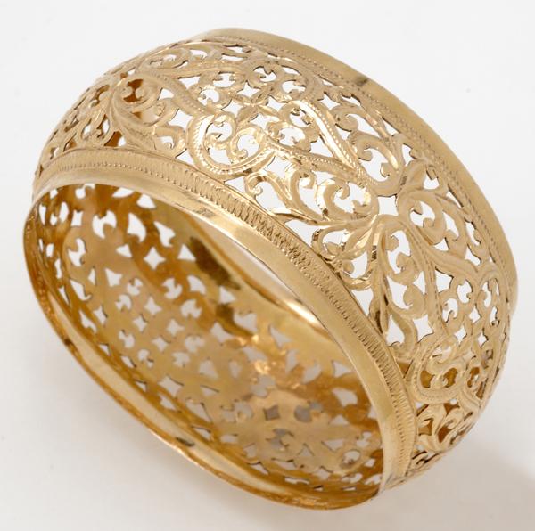 Appraisal: PIERCED GOLD BANGLE Broad k yg arched cuff gs