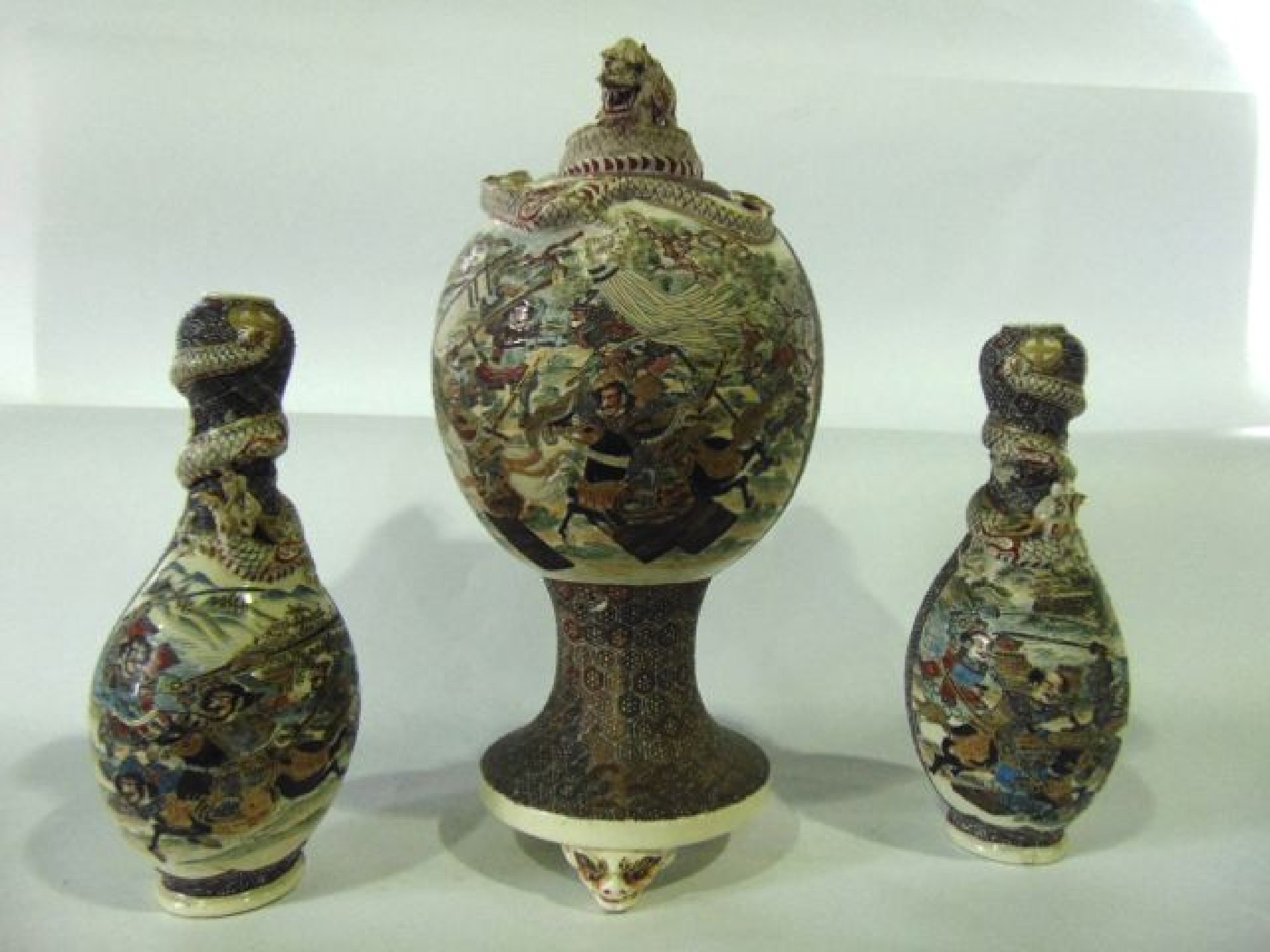 Appraisal: A late th century Satsuma garniture of three vases comprising