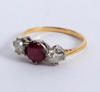 Appraisal: A ruby and diamond three-stone ring claw set in white