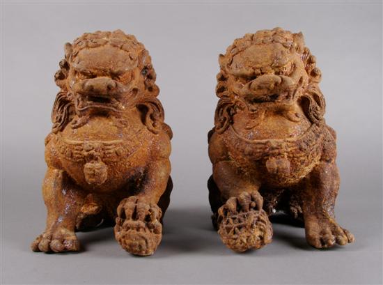 Appraisal: A Pair of Chinese Cast Iron Buddhistic Lions Height inches