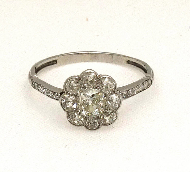 Appraisal: An early th century diamond nine stone flower-head cluster ring