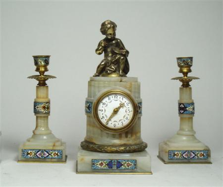 Appraisal: A th century white marble and enamel clock garniture the