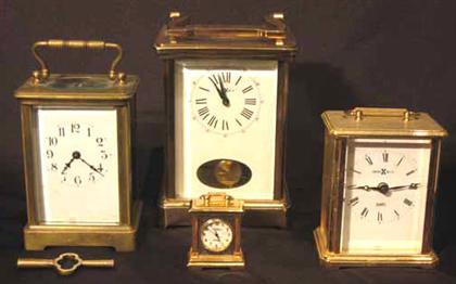 Appraisal: Four piece brass carriage clocks howard miller st martin and