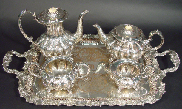 Appraisal: s silver plated four piece tea set the bodies chased