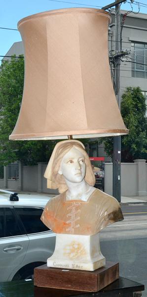 Appraisal: AN ALABASTER TABLE LAMP IN THE FORM OF JOAN OF