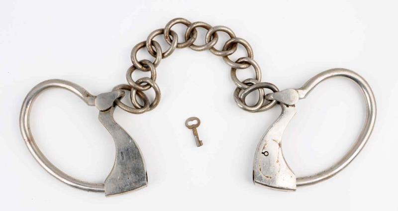 Appraisal: Towers Leg Irons No key Last patent date is Slight