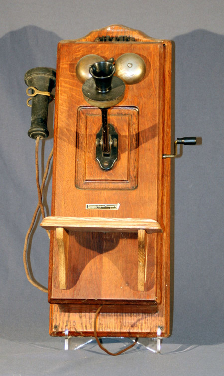 Appraisal: Stromberg-Carlson Oak Wall Telephone and a Brass Telephone First Quarter